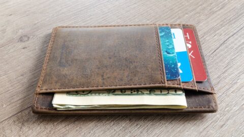 Brown Leather Wallet and Us Dollar Banknote